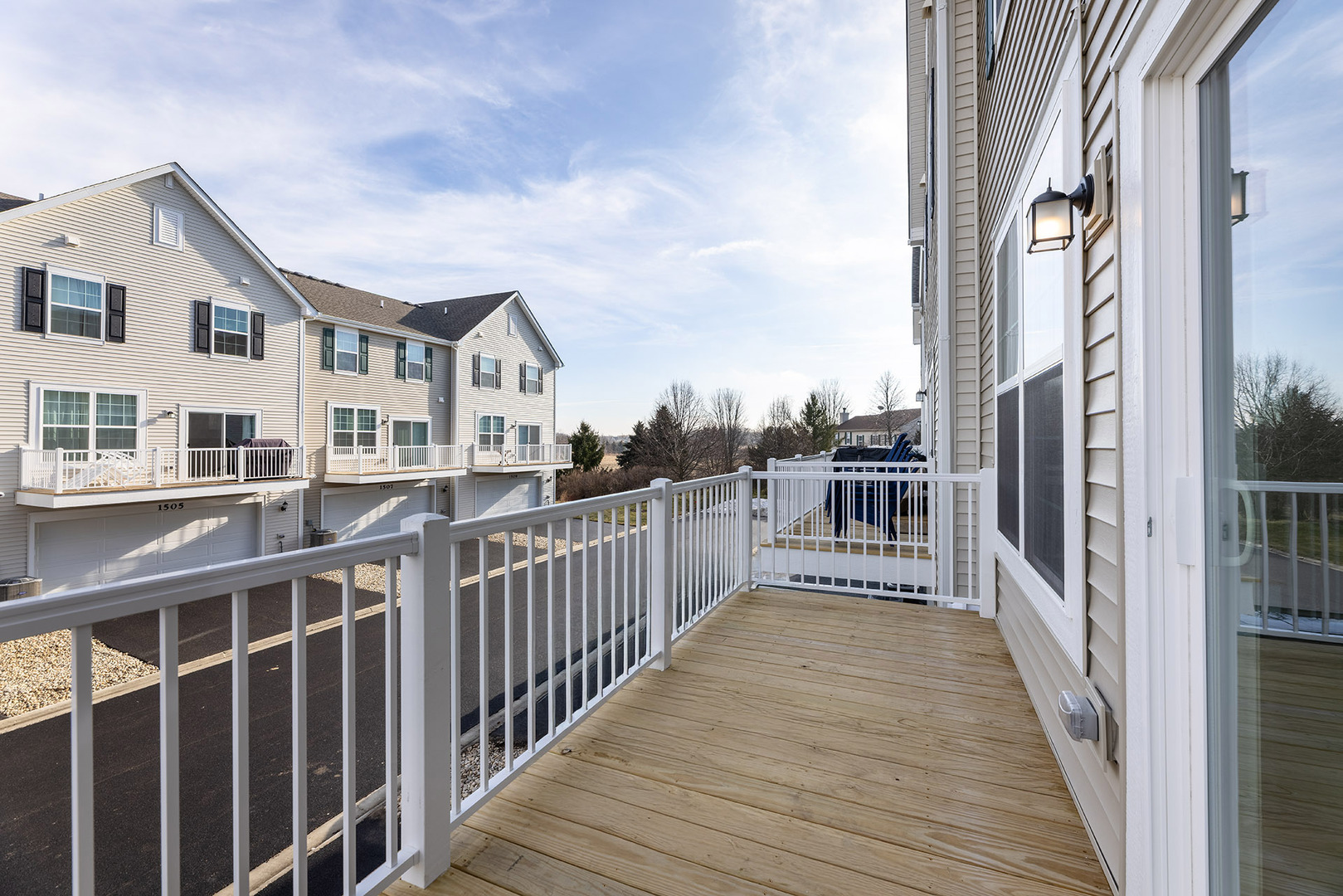 1703 Neubauer Circle Lindenhurst, IL 60046 - Photo 17 of 37 a view of a house with wooden deck