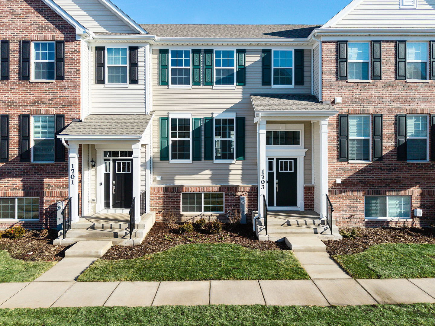 1703 Neubauer Circle Lindenhurst, IL 60046 - Photo 2 of 37 a view of a brick building with many windows