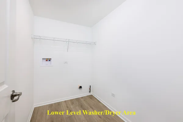 a view of a room with wooden floor