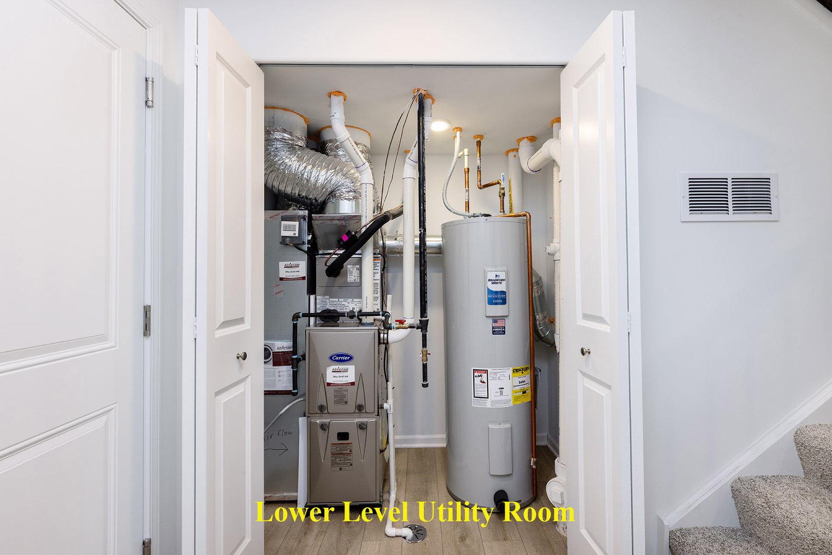 1703 Neubauer Circle Lindenhurst, IL 60046 - Photo 32 of 37 a view of a hallway with white walls and closet