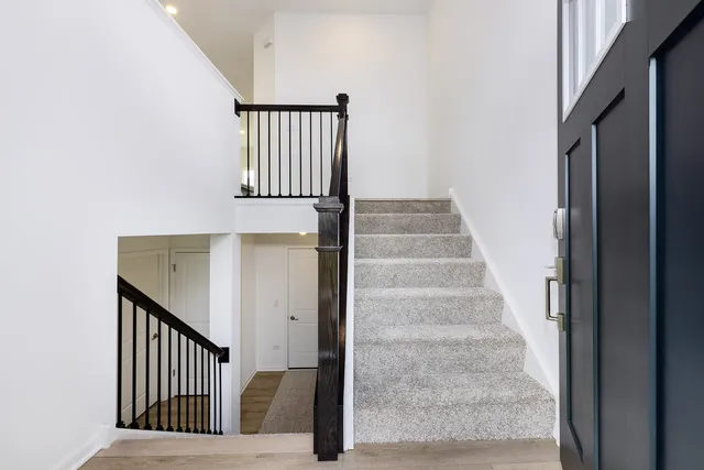 a view of entryway with wooden floor