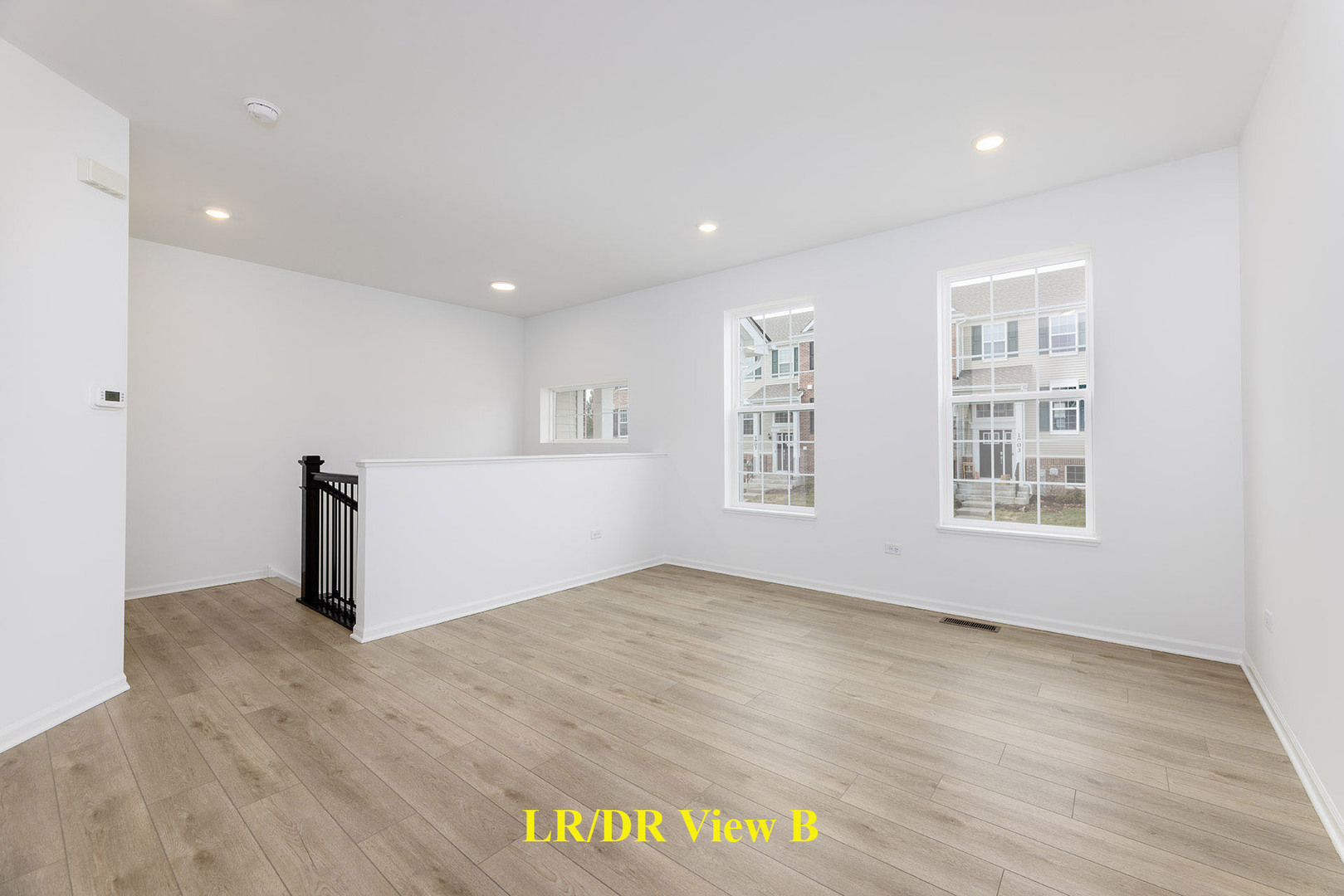 1703 Neubauer Circle Lindenhurst, IL 60046 - Photo 7 of 37 a view of empty room with wooden floor and fan