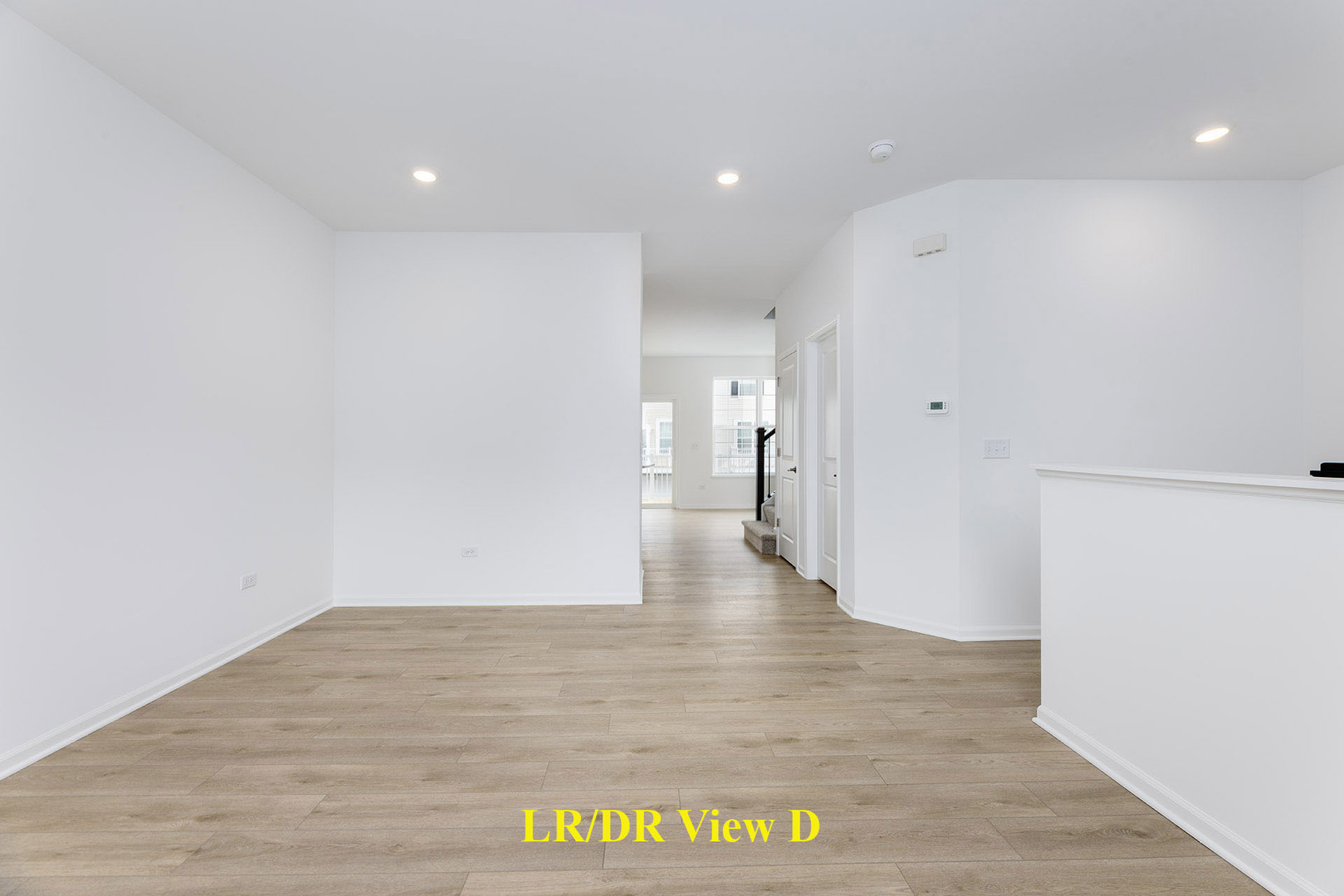 1703 Neubauer Circle Lindenhurst, IL 60046 - Photo 9 of 37 a view of an empty room with wooden floor