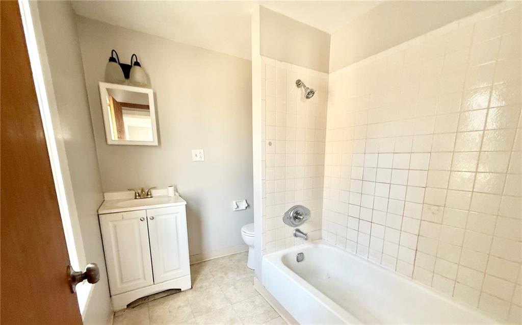 927 Vankirk Street Clairton, PA 15025 - Photo 6 of 8 a bathroom with a bathtub sink and toilet