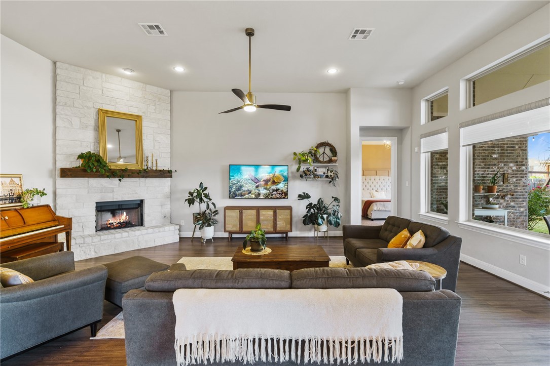 4036 Brean Down Road Pflugerville, TX 78660 - Photo 1 of 1 a living room with fireplace furniture and a large window