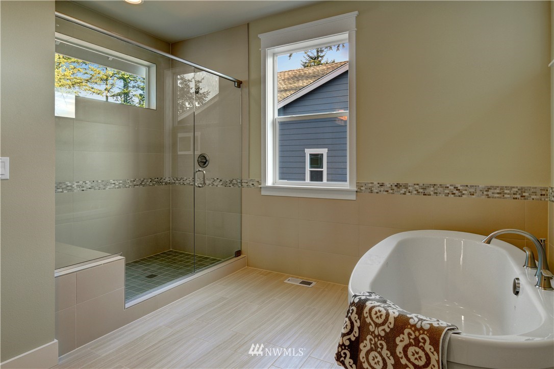 329 Field Place Southeast Renton, WA 98059 - Photo 13 of 19 a bathroom with a bathtub and a shower