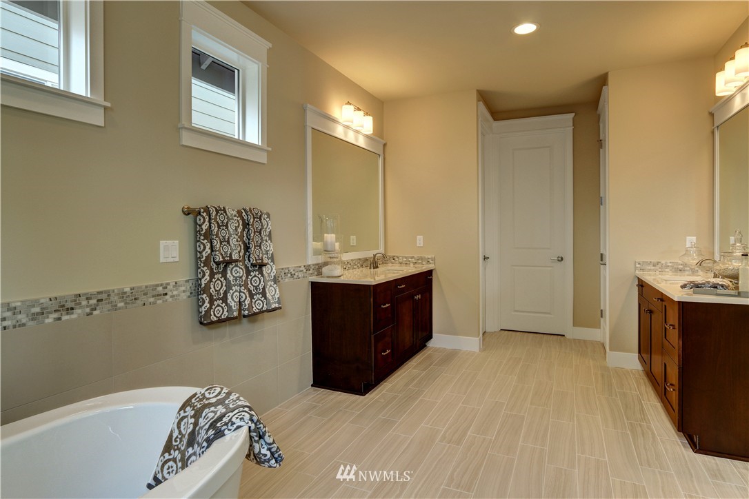 329 Field Place Southeast Renton, WA 98059 - Photo 14 of 19 a spacious bathroom with a tub sink and mirror