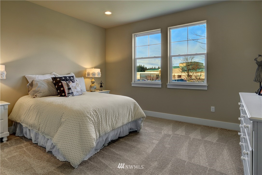 329 Field Place Southeast Renton, WA 98059 - Photo 16 of 19 a bedroom with a bed and window