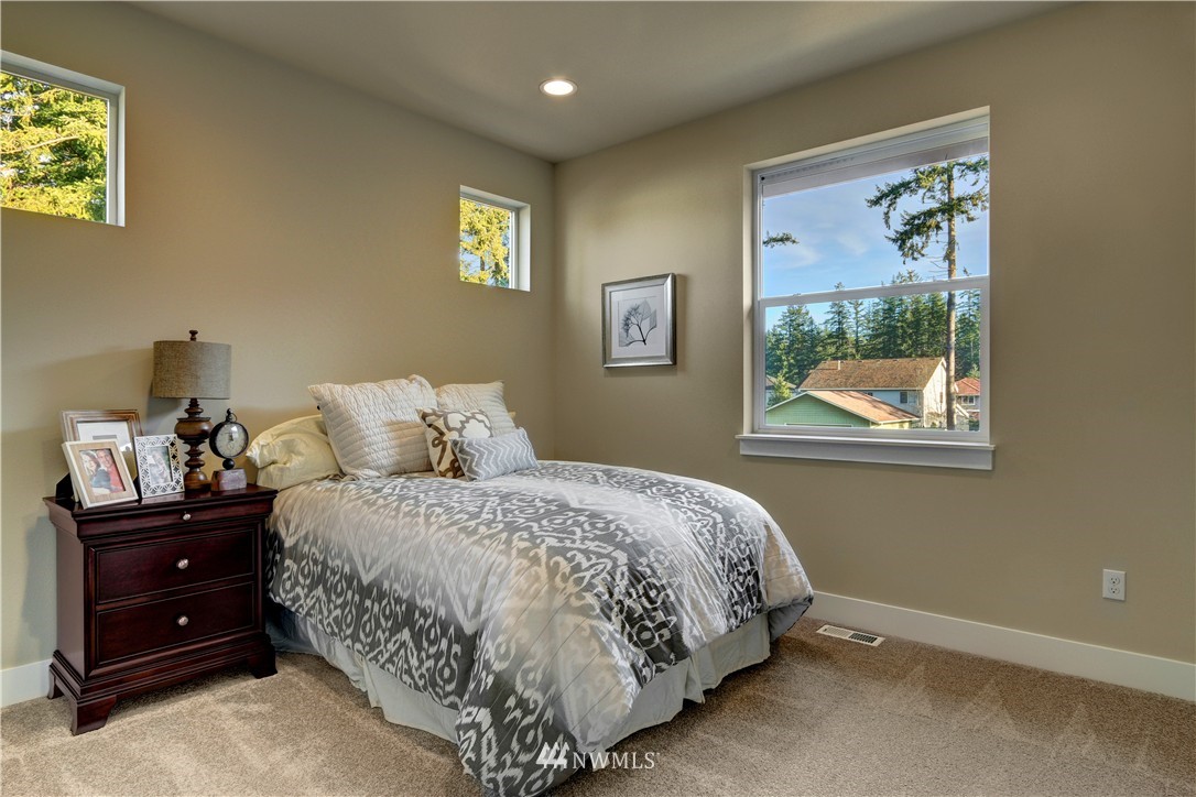 329 Field Place Southeast Renton, WA 98059 - Photo 17 of 19 a bedroom with a bed and a window