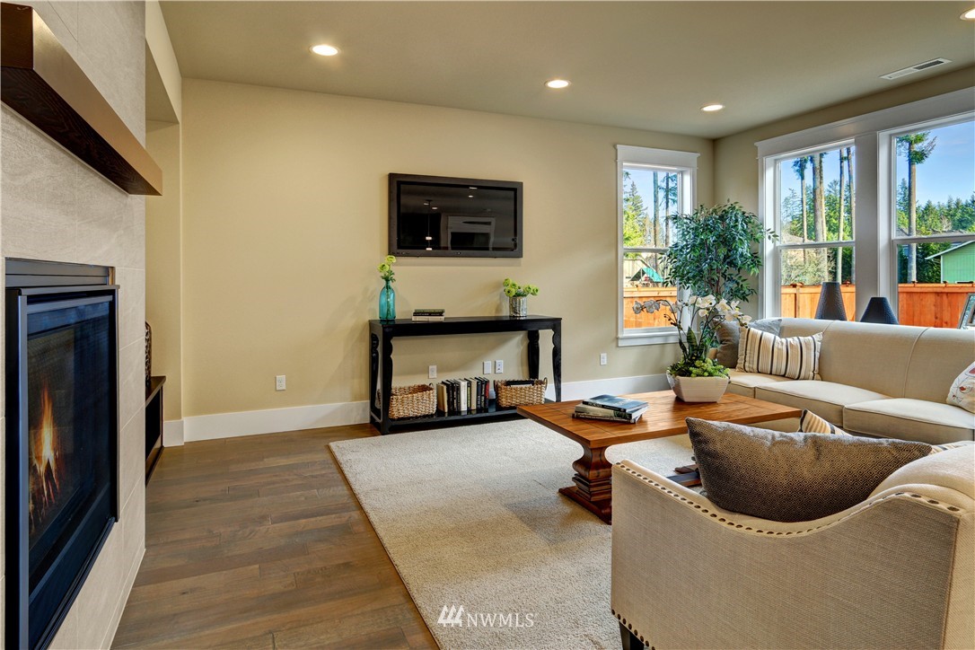329 Field Place Southeast Renton, WA 98059 - Photo 8 of 19 a living room with furniture and a flat screen tv