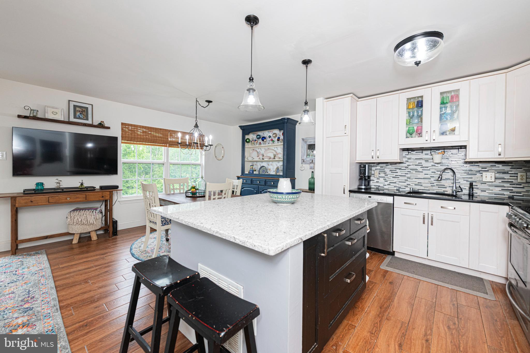 706 Melvin Road Telford, PA 18969 - Photo 11 of 55 a kitchen with stainless steel appliances kitchen island granite countertop a stove a sink and a refrigerator