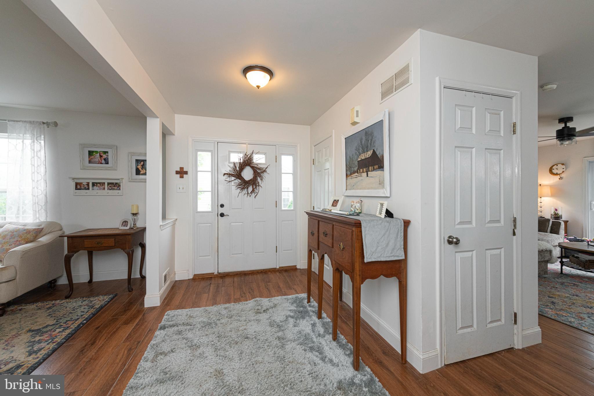 706 Melvin Road Telford, PA 18969 - Photo 3 of 55 a view of a livingroom with furniture and hardwood floor