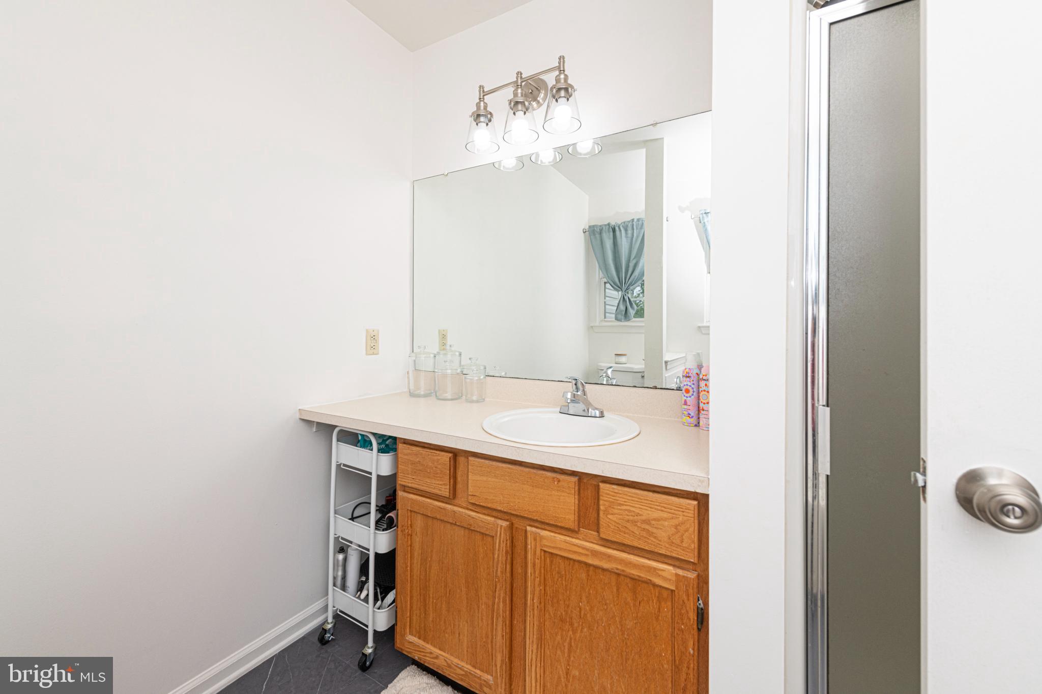 706 Melvin Road Telford, PA 18969 - Photo 33 of 55 a bathroom with a sink and a mirror