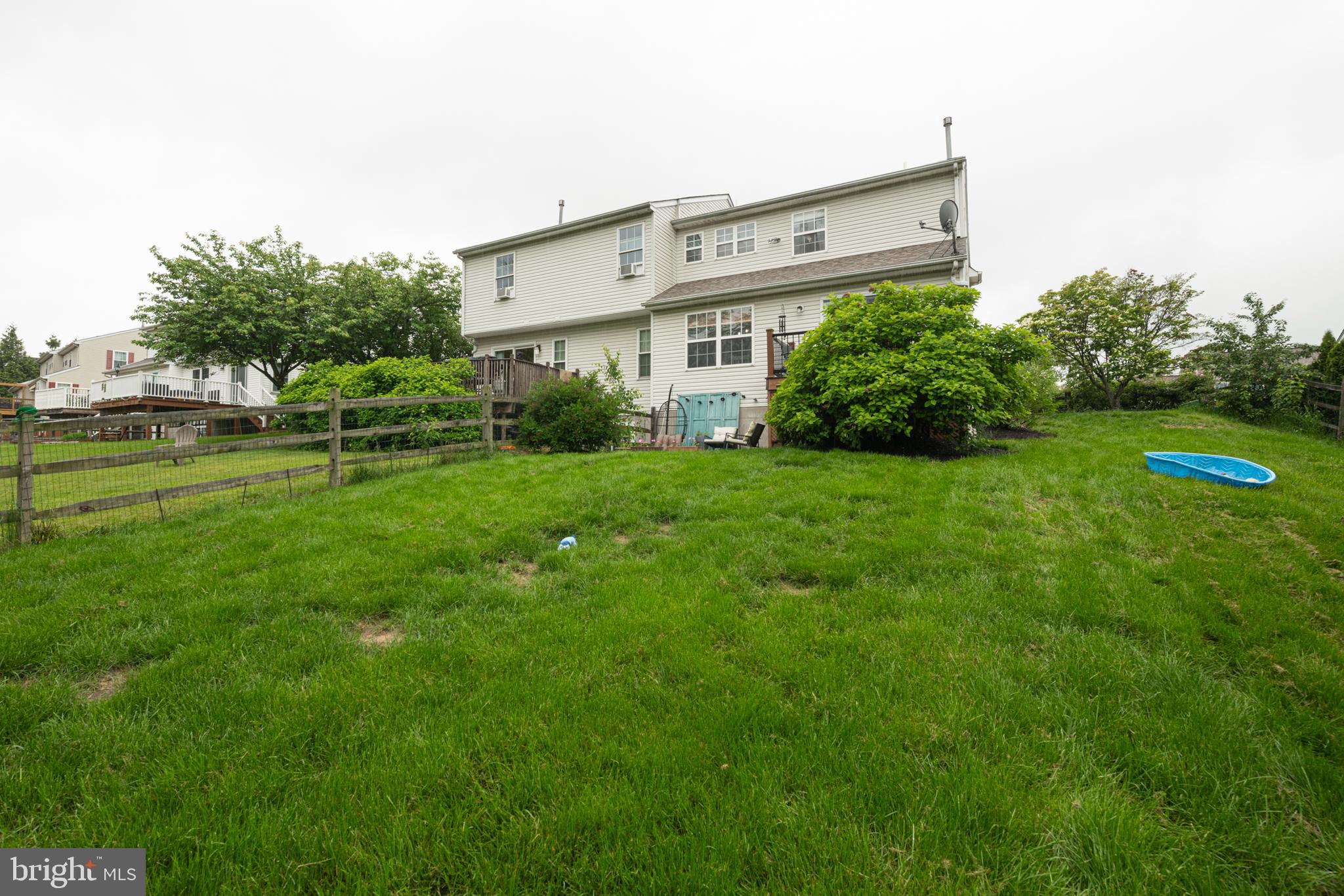 706 Melvin Road Telford, PA 18969 - Photo 38 of 55 a view of a house with a big yard and potted plants