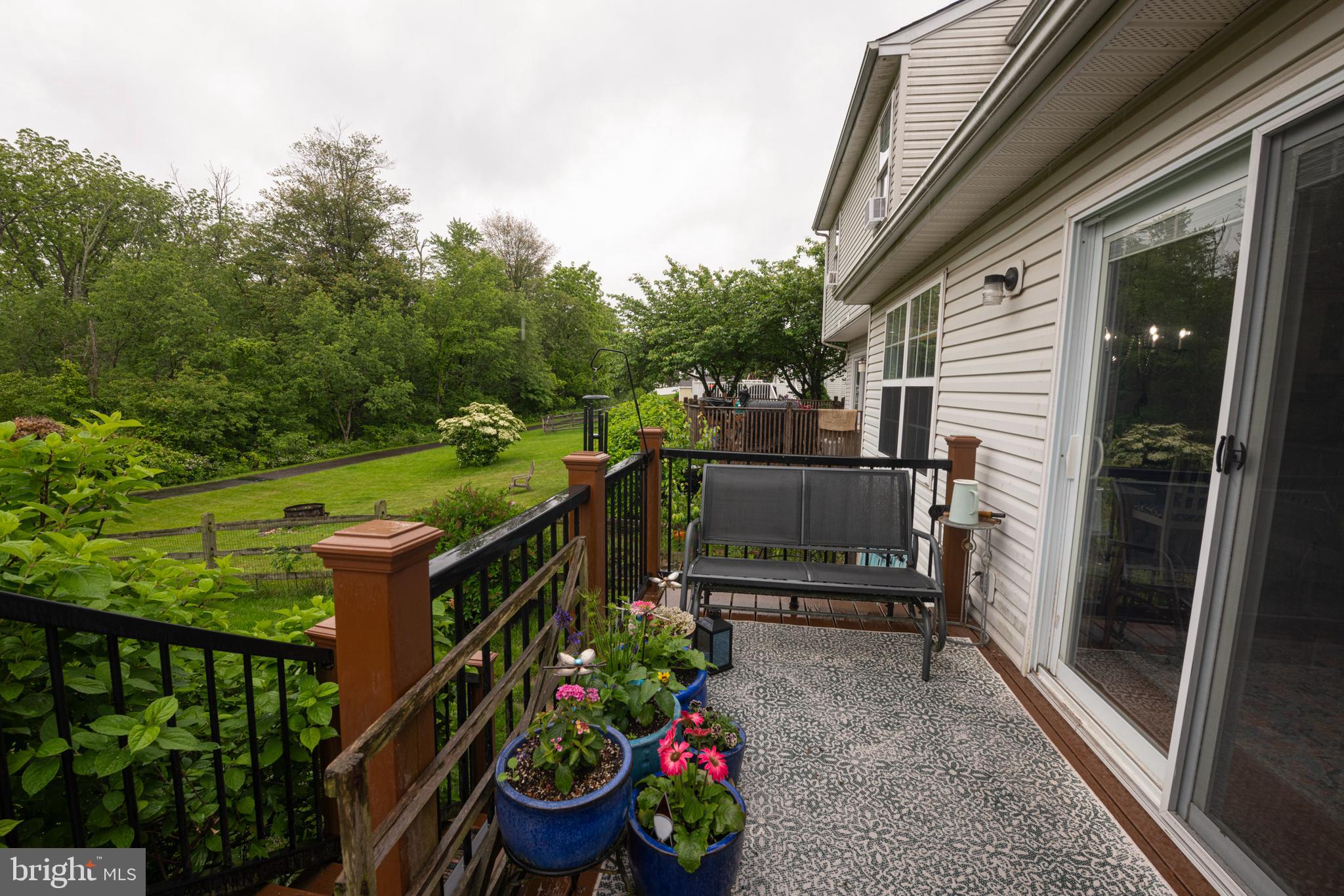 706 Melvin Road Telford, PA 18969 - Photo 44 of 55 a view of a balcony with chairs and wooden fence