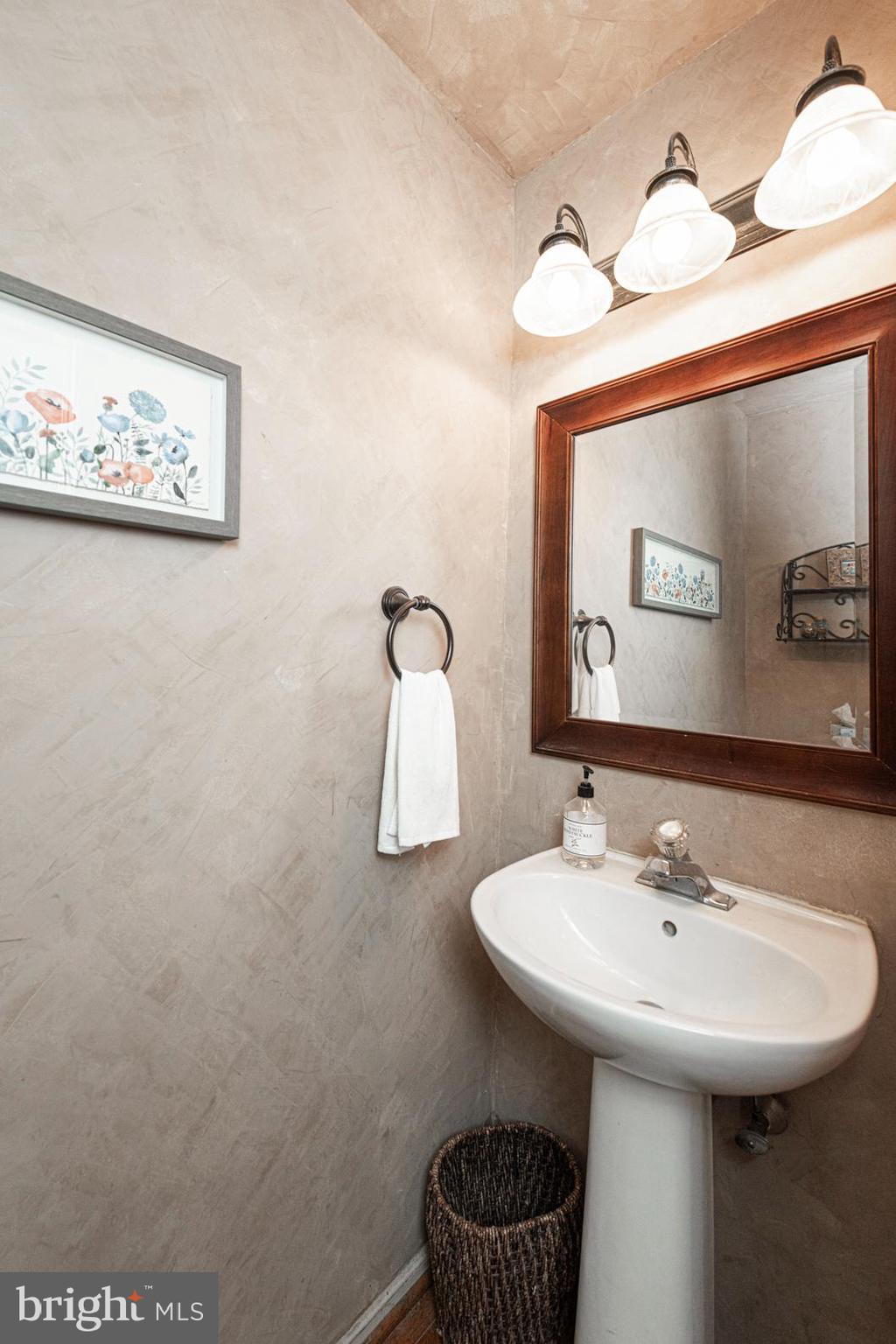 706 Melvin Road Telford, PA 18969 - Photo 5 of 55 a bathroom with a sink and a mirror