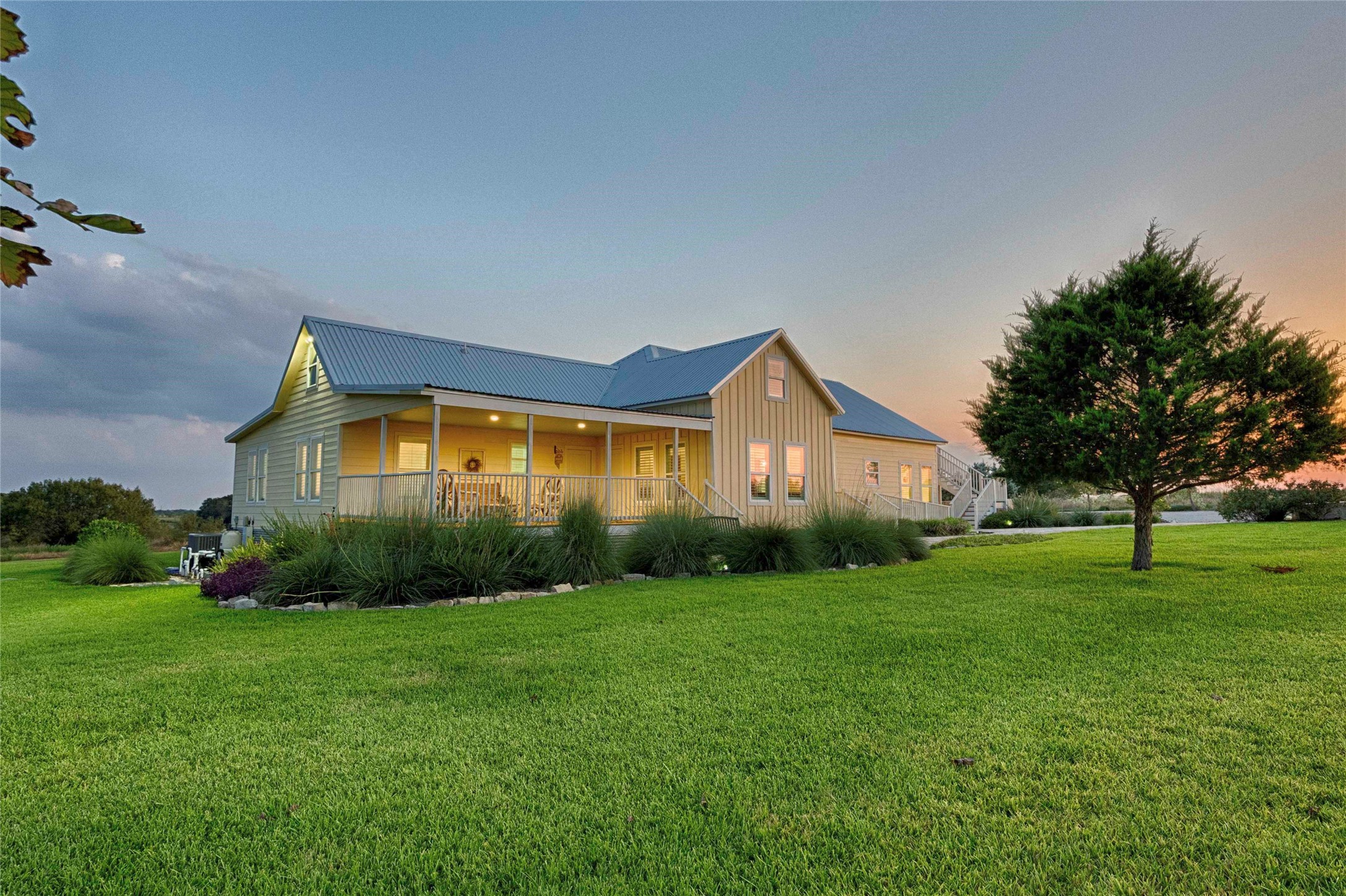 a front view of house with yard and green space