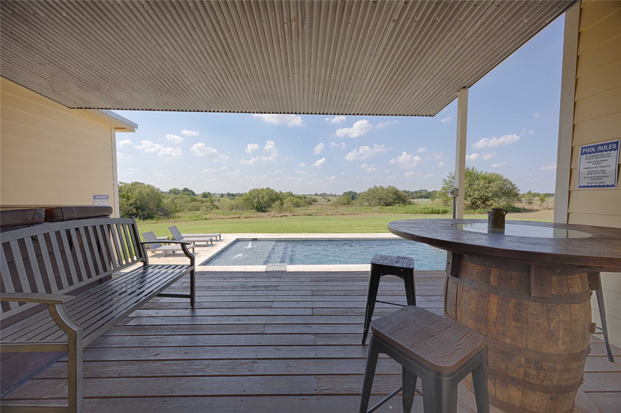 2210 Fm 615 Schulenburg, TX 78956 - Photo 12 of 49 a view of a terrace with wooden floor and fence