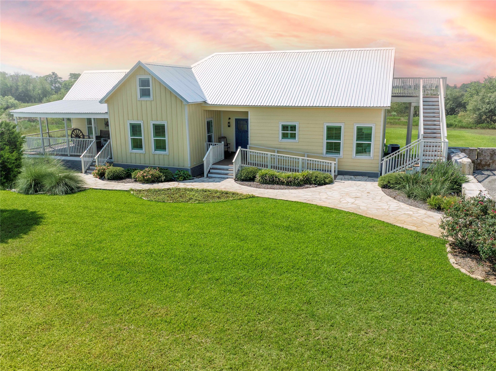 2210 Fm 615 Schulenburg, TX 78956 - Photo 13 of 49 a front view of a house with a yard and porch