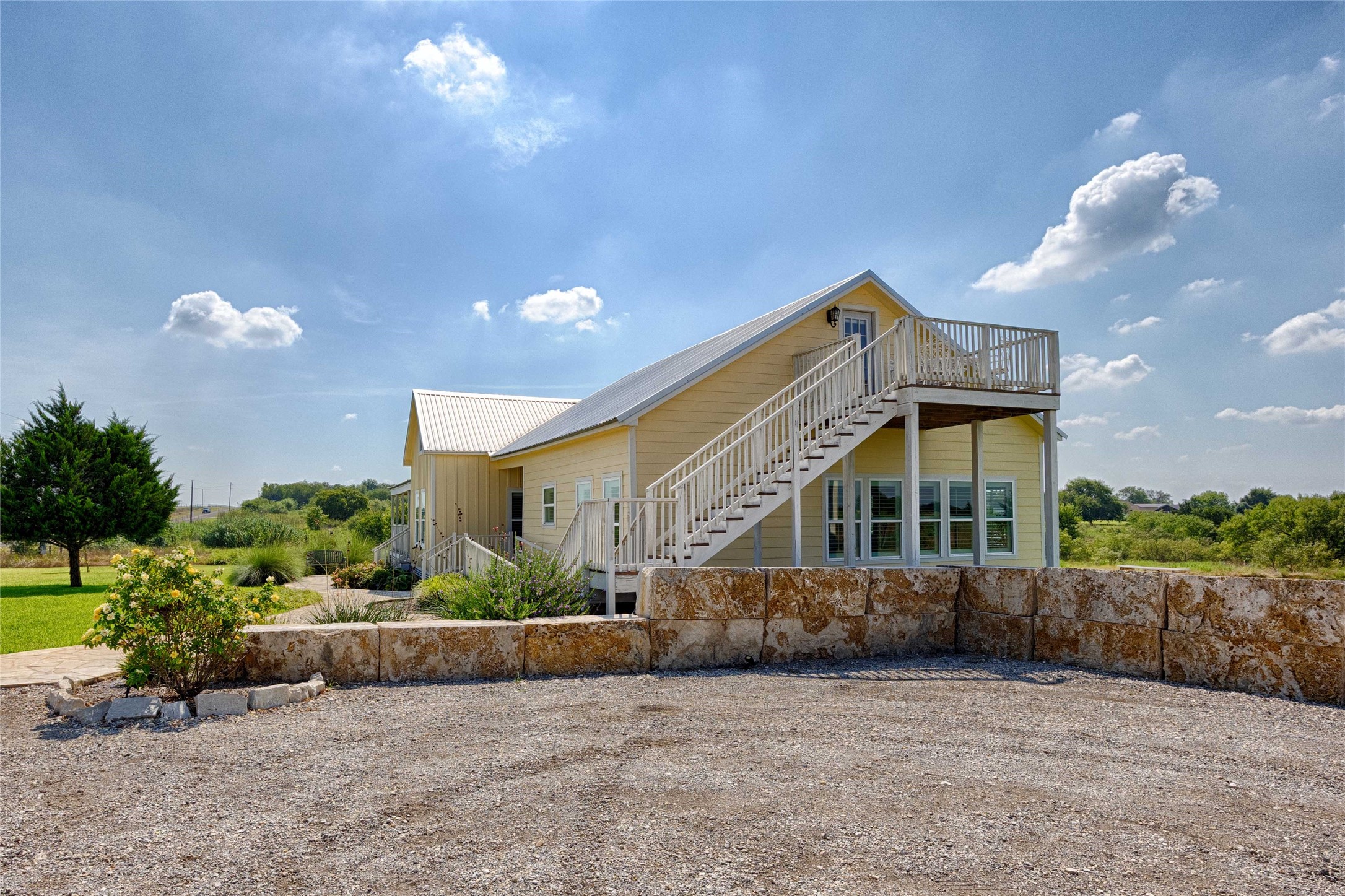2210 Fm 615 Schulenburg, TX 78956 - Photo 14 of 49 a view of a house with a yard and potted plants