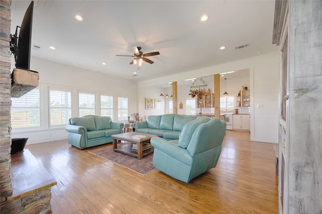 a living room with furniture and a fireplace
