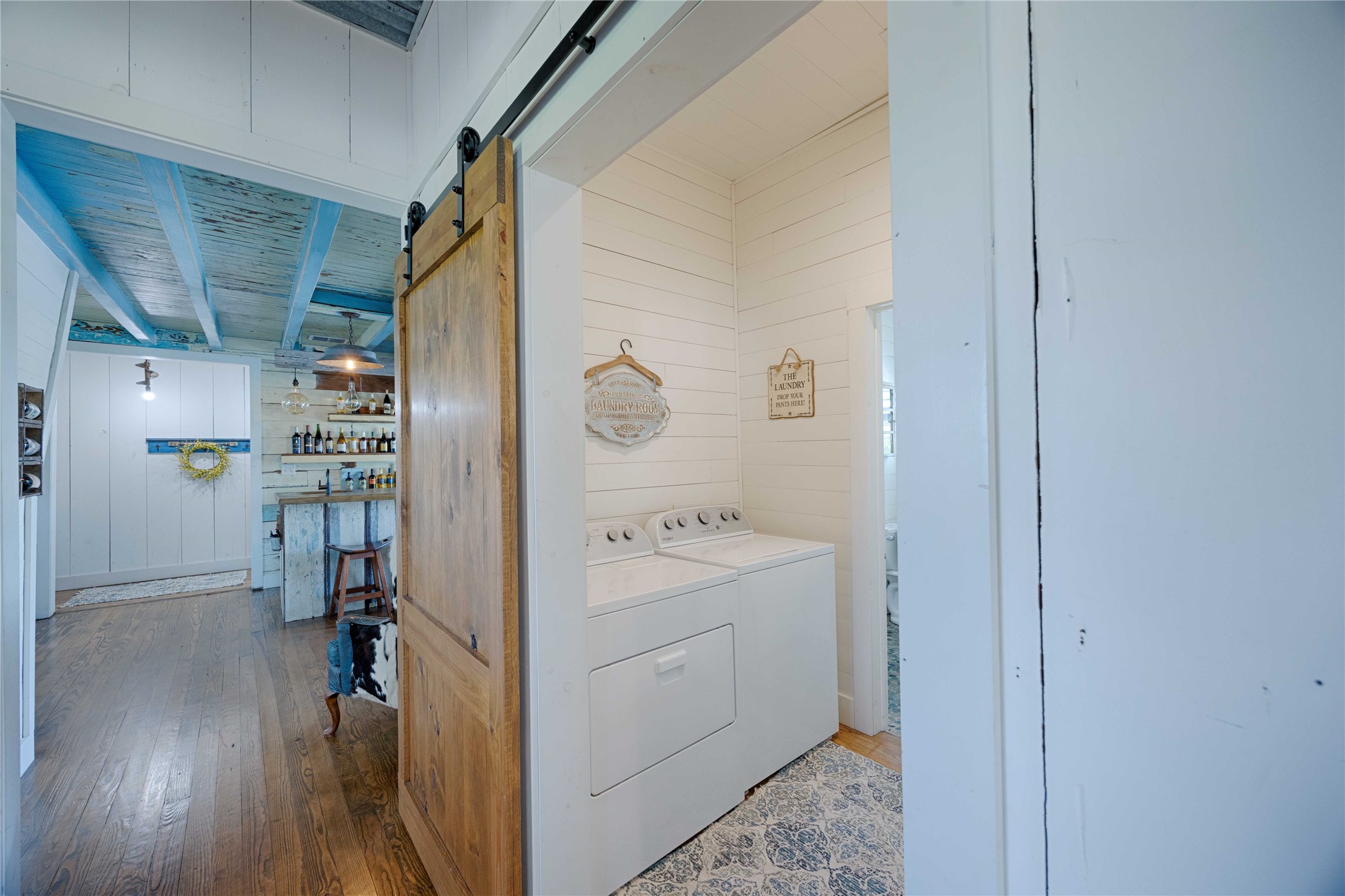 2210 Fm 615 Schulenburg, TX 78956 - Photo 31 of 49 a view of a hallway with bathroom and wooden floor