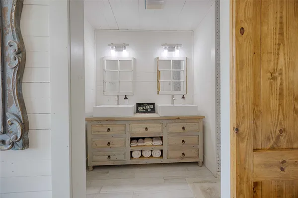 a bedroom with bed and wooden floor