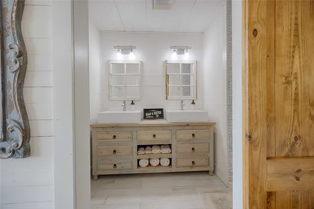 a bedroom with bed and wooden floor