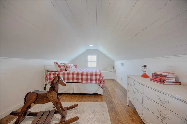 a view of a balcony with furniture and wooden floor