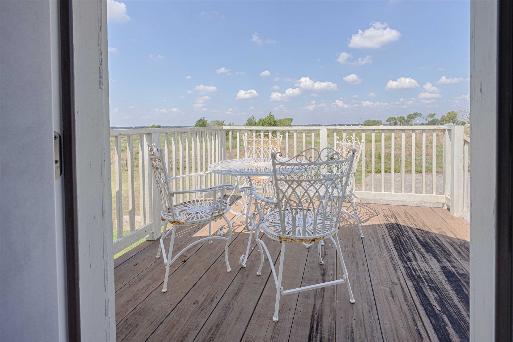 2210 Fm 615 Schulenburg, TX 78956 - Photo 47 of 49 a view of a balcony with furniture and wooden floor