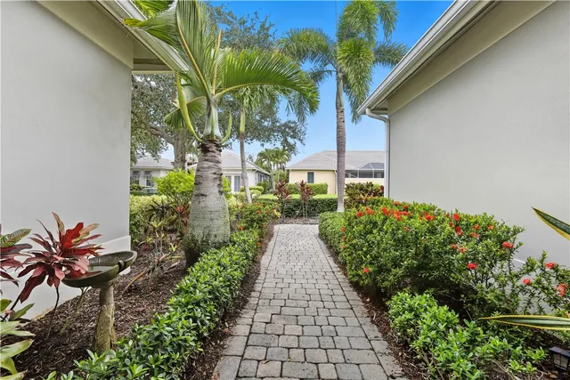 a view of a backyard with potted plants