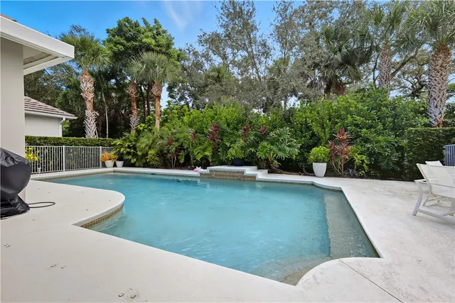a view of a swimming pool with a patio