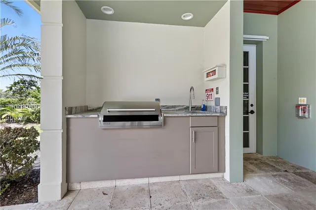 a kitchen with a refrigerator and a stove