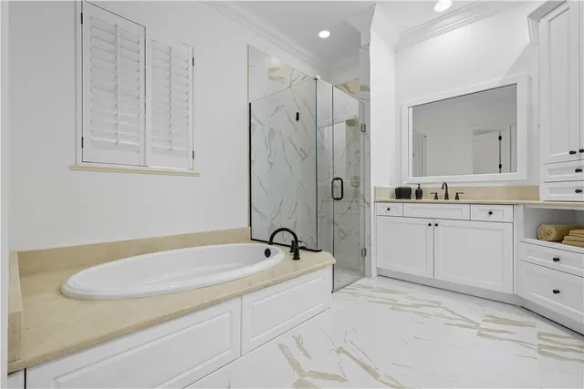 a spacious bathroom with a sink and a mirror