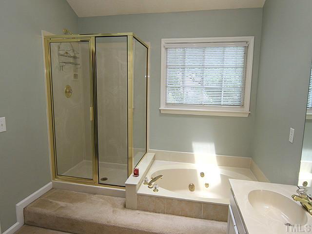 4000 Kettering Drive Durham, NC 27713 - Photo 8 of 12 Huge Master Bath features separate tub and shower, dual-sink vanity, and walk-in closet