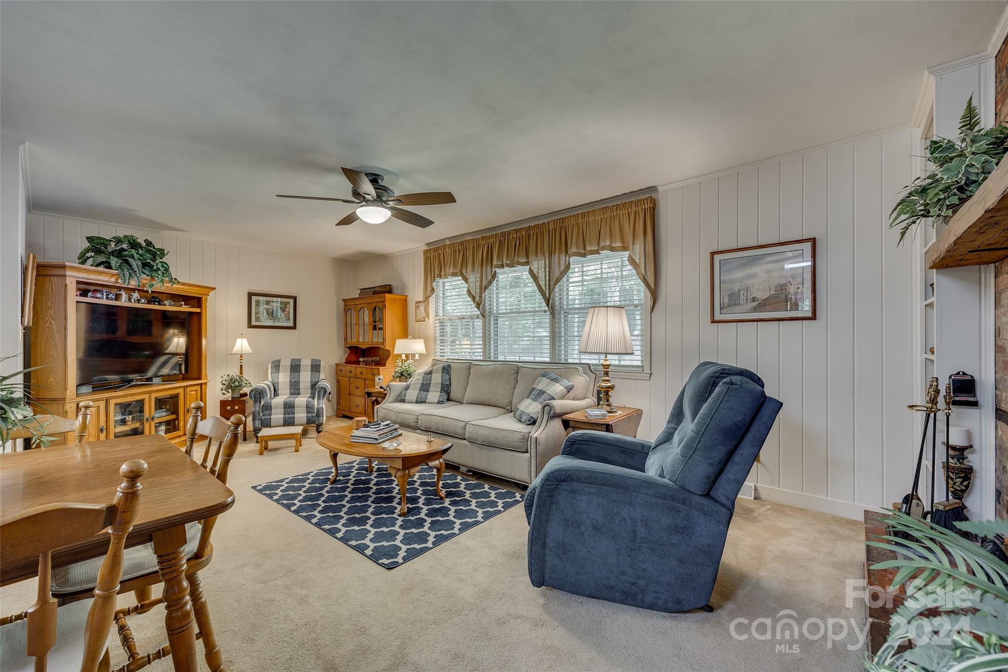 812 Lakeside Circle Lancaster, SC 29720 - Photo 11 of 32 a living room with furniture a flat screen tv and a window