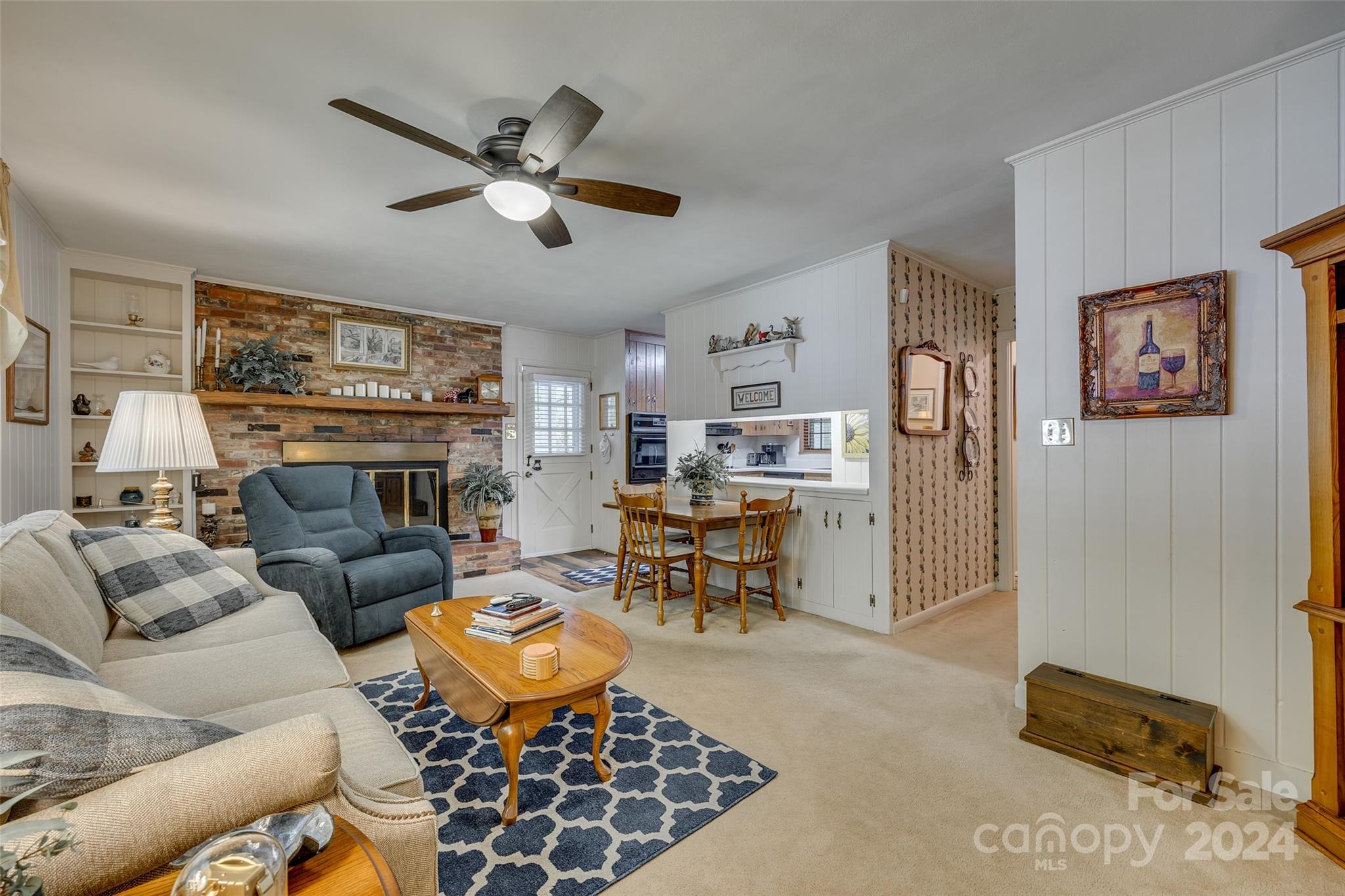 812 Lakeside Circle Lancaster, SC 29720 - Photo 13 of 32 a living room with furniture a fireplace and a large window