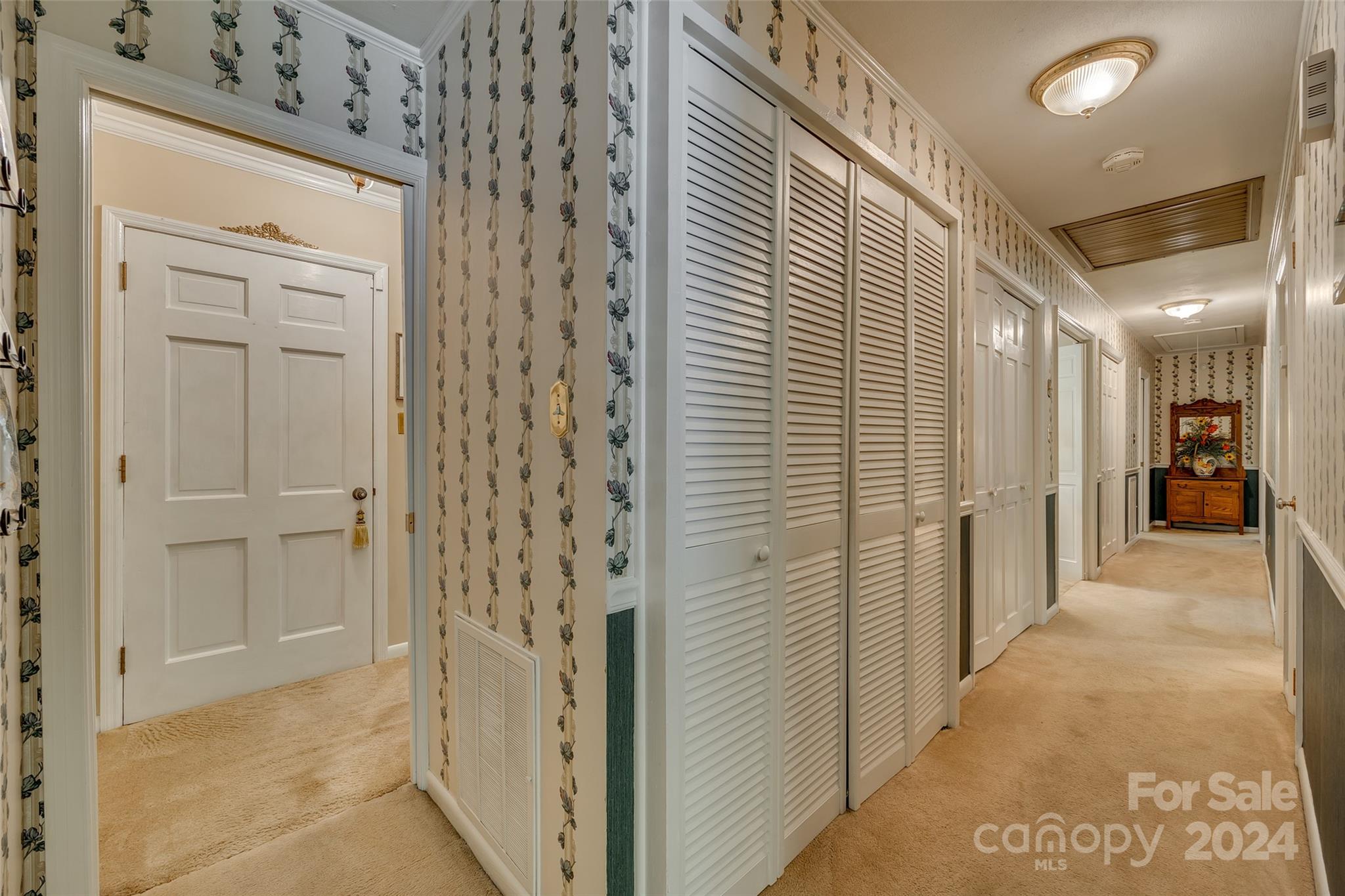 812 Lakeside Circle Lancaster, SC 29720 - Photo 17 of 32 a view of a hallway with wooden shelves
