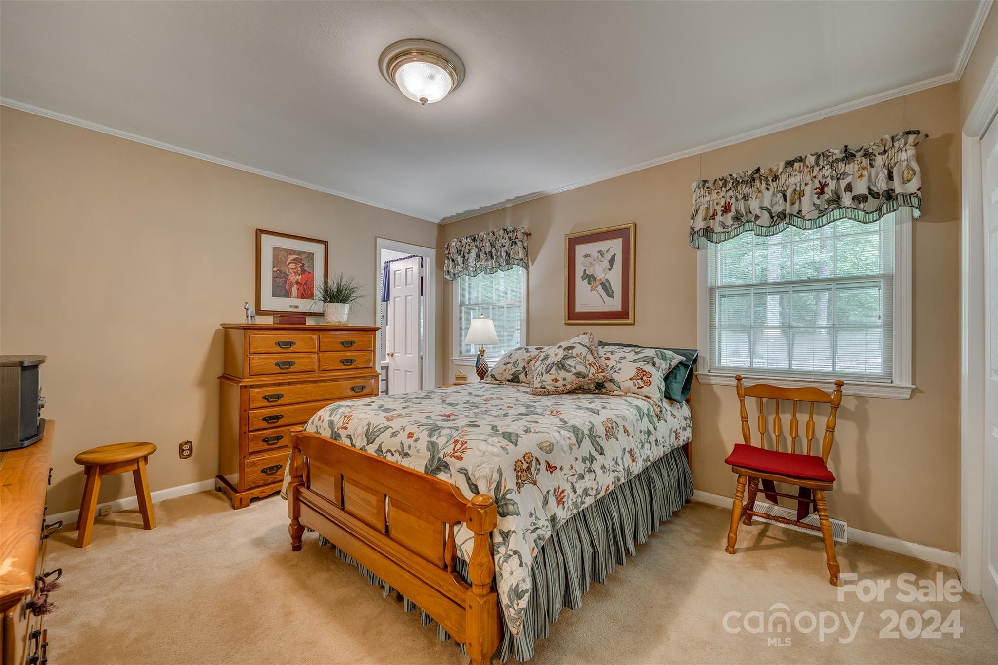 812 Lakeside Circle Lancaster, SC 29720 - Photo 22 of 32 a bedroom with a bed a dresser and next to a window
