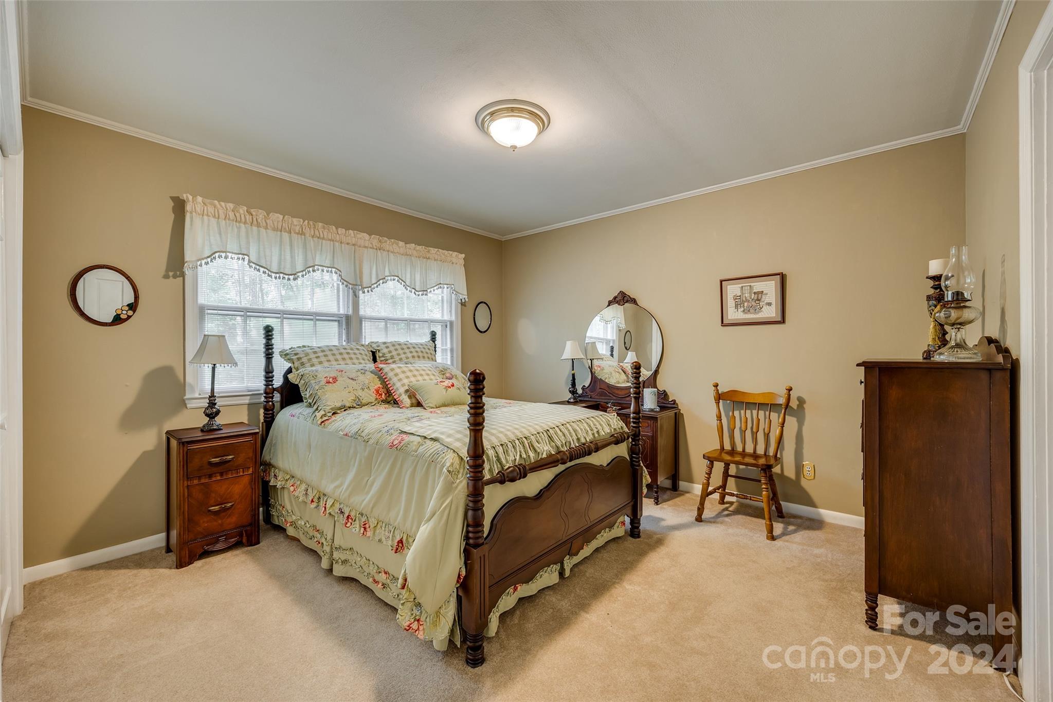 812 Lakeside Circle Lancaster, SC 29720 - Photo 25 of 32 a bed sitting in a bedroom next to a window