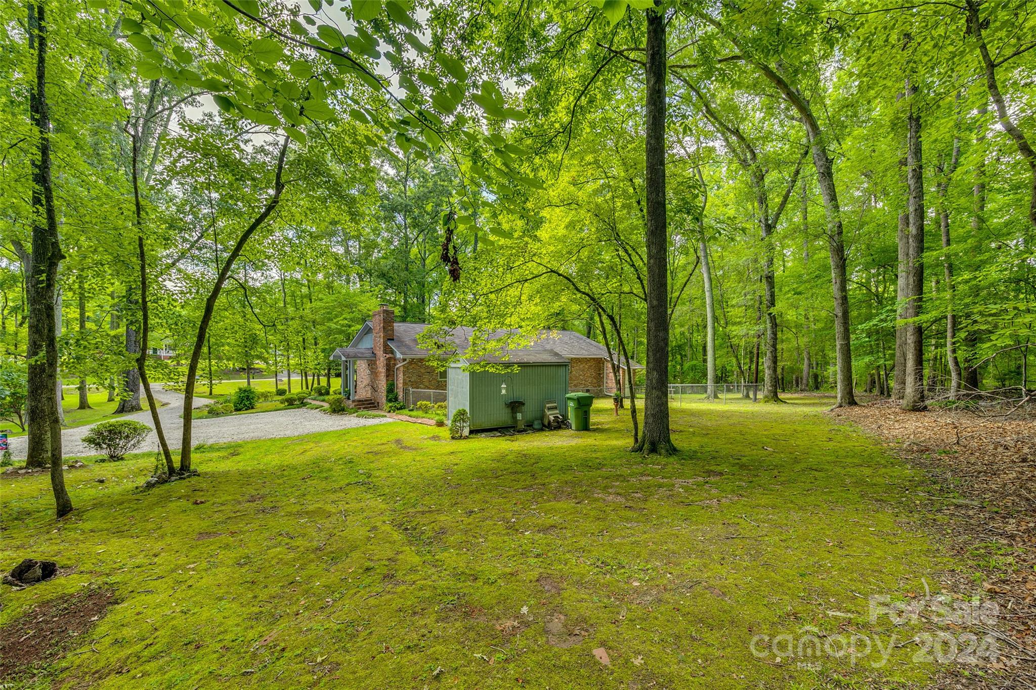 812 Lakeside Circle Lancaster, SC 29720 - Photo 29 of 32 a yellow house in middle of the forest