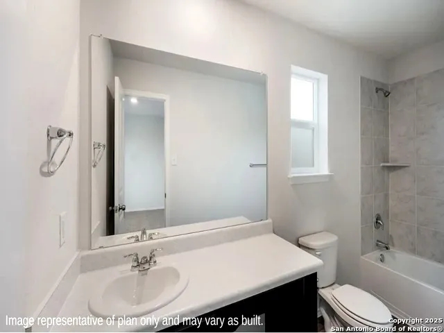 a bathroom with a sink toilet tub and shower