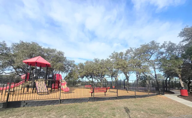 a view of a park with swings