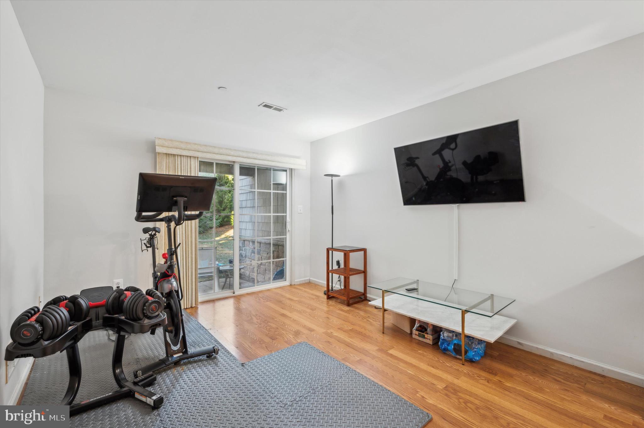 212 Cobblestone Drive Ardmore, PA 19003 - Photo 14 of 15 a living room with furniture and a flat screen tv