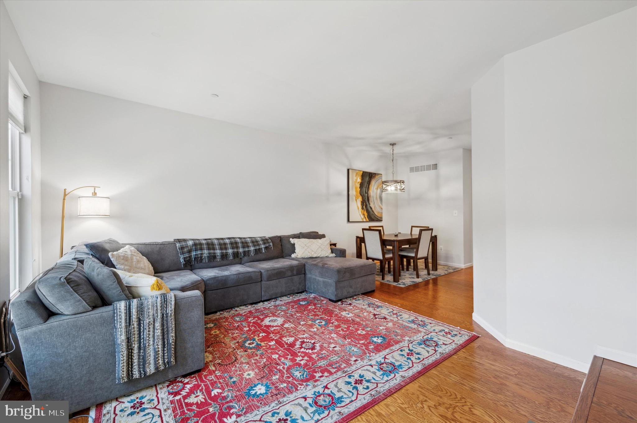 212 Cobblestone Drive Ardmore, PA 19003 - Photo 9 of 15 a living room with furniture and a rug