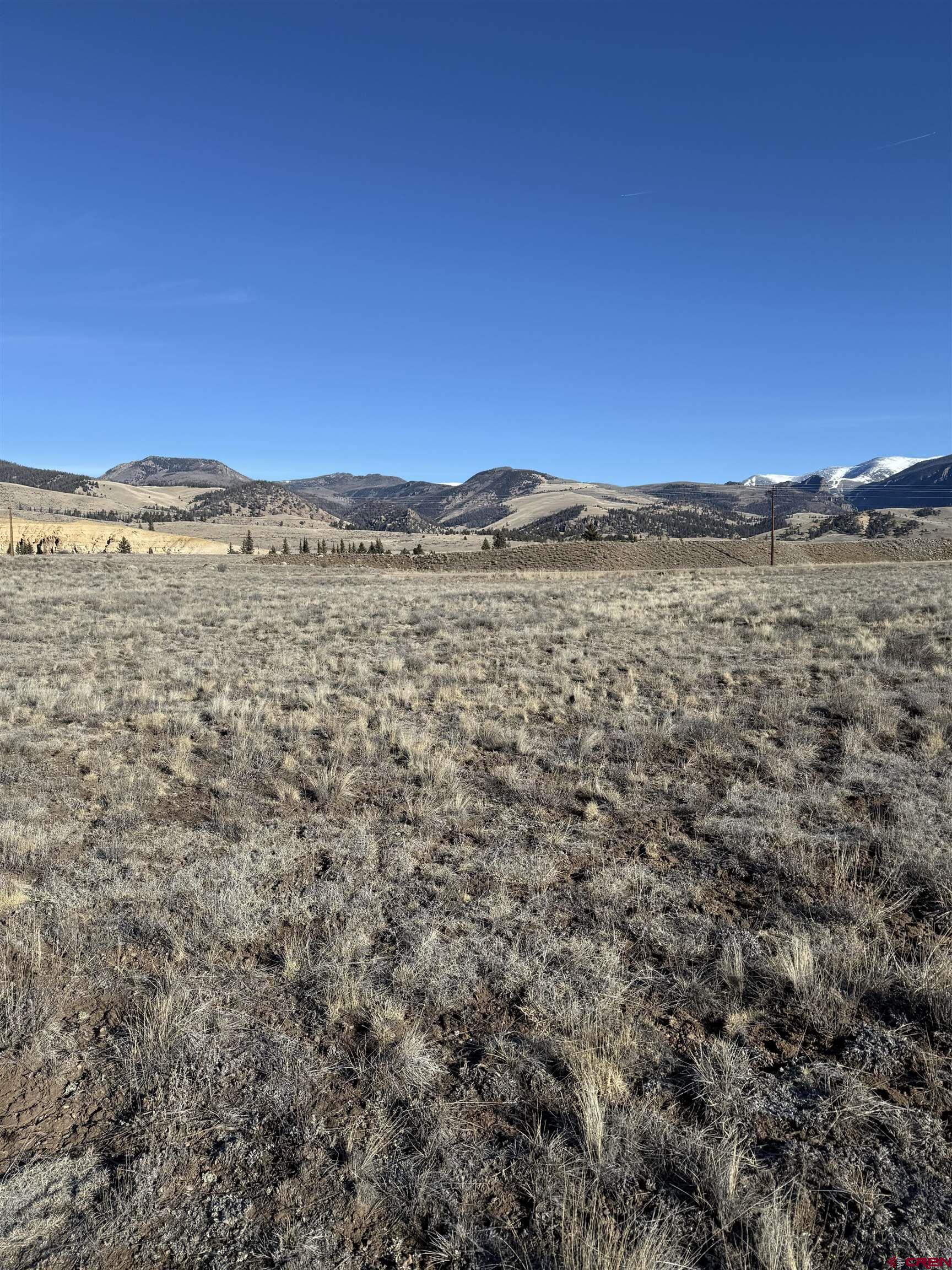 4860 Deep Creek Road Creede, CO 81130 - Photo 4 of 19 a view of a large building with mountains in the background