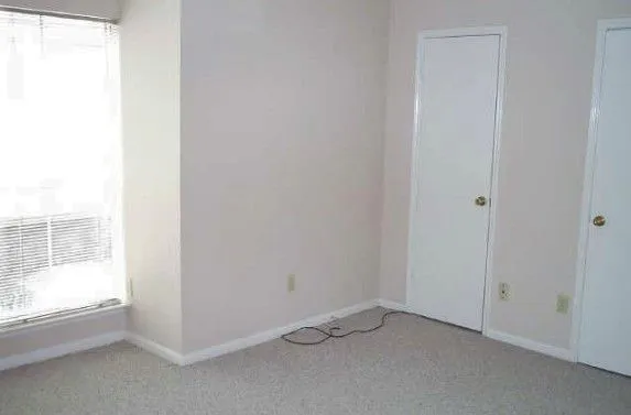 a view of a building with a yard