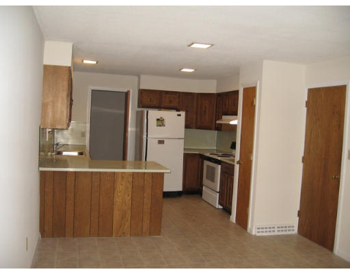 46 High Point Drive Amherst, MA 01002 - Photo 8 of 14 a kitchen with stainless steel appliances kitchen island granite countertop a refrigerator and a stove