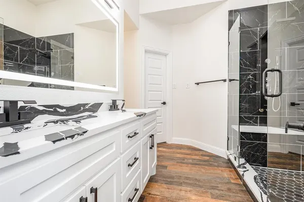 a bathroom with a sink and a mirror