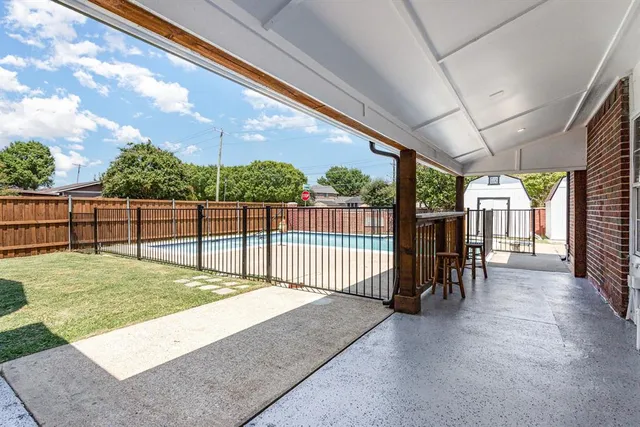 a view of a porch with wooden floor